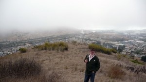 David Schooley, founder of SBMW, on the ridge trail behind Sign Hill Park. Behind him is the land in question. Photo by Heather Mack.