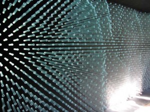 Ronald Rael and Virginia San Fratello created the SOL Grotto by perforating one side of a small plywood structure with discarded tubes from the defunct Solyndra factory in Fremont. Photo by Tamara Schwarz.