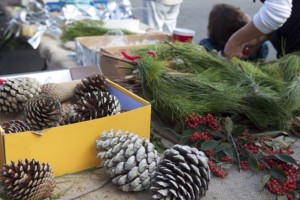 The Pacifica Land Trust set up a wreath-making station to do something with all the extra Monterey pine branches. Photo by Alison Hawkes.