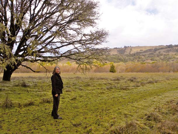 Kathy Bailey stands in a field