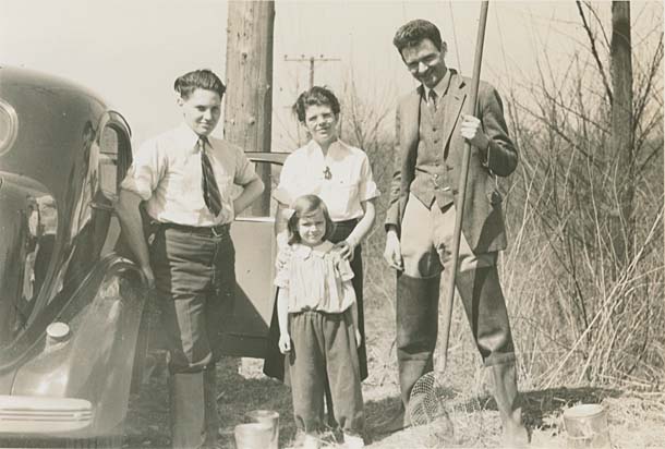 Young Doris Sloan with father in the field