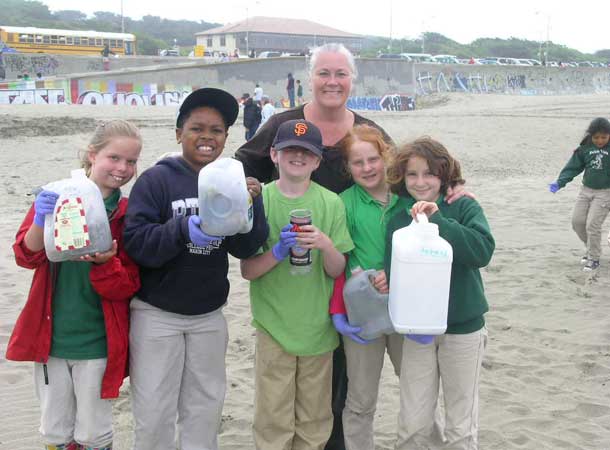 Kids with beach trash they've cleaned up