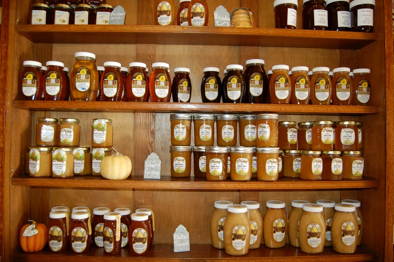Wall filled with Bay Area honey for sale at Her Majesty's Secret Beekeeper in San Francisco's Mission District. Photo by Courtney Quirin.