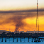 The Richmond Chevron refinery ablaze in August 2012. Creative commons photo by TheRealMichaelMoore.