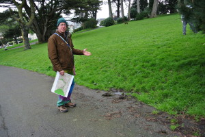 Natural history educator and tour guide Joel Pomerantz points out wet areas in Alamo Square Park that could be the result of old underground springs.  Photo: Dhyana Levey.