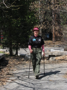 Adventure Buddies' Jayah Faye Paley walking with poles