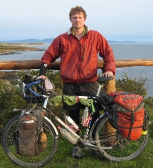 San Francisco-based climate scientist, journalist and educator David Kroodsma with his bike, Del Fuego, at the southernmost tip of South America.