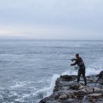 Fly-fishing and wilderness guide Jack Harrison casts into the surf.