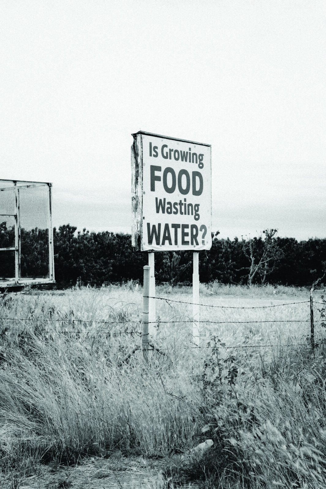 Sign reading "Is Growing Food Wasting Water?"